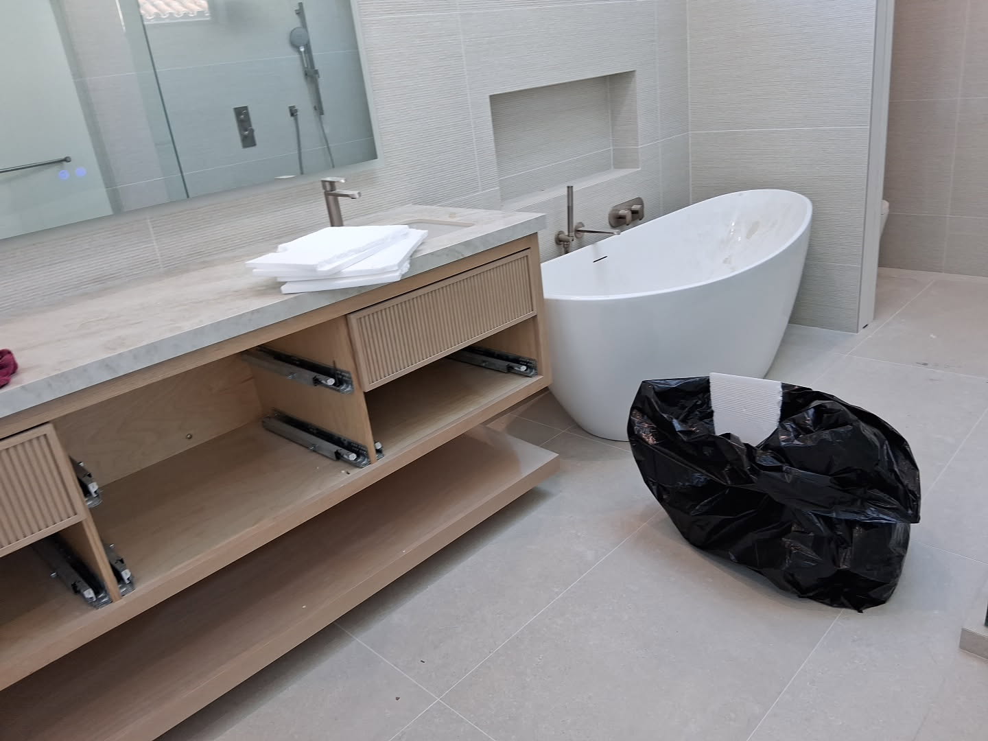 The risk of cheap cleaning: streaks and residue left on windows after an improper post-construction clean.